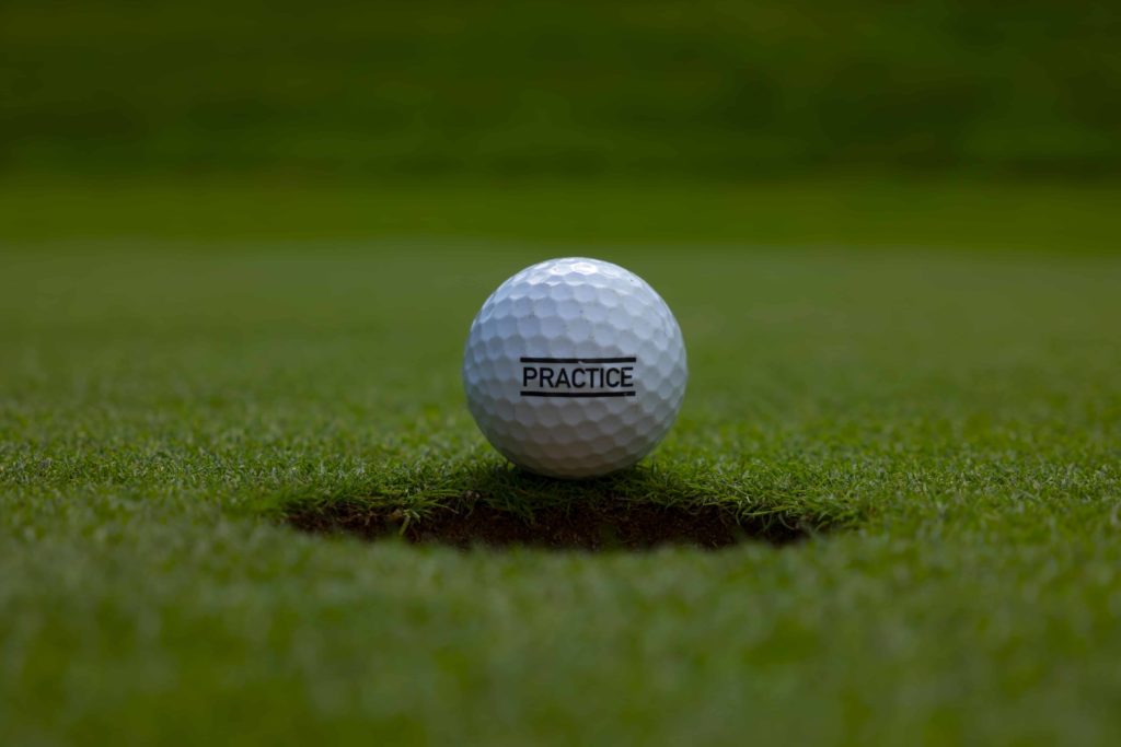 practice golf ball on grass